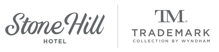 A logo for stone hill hotel and tm trademark collection by wyndham