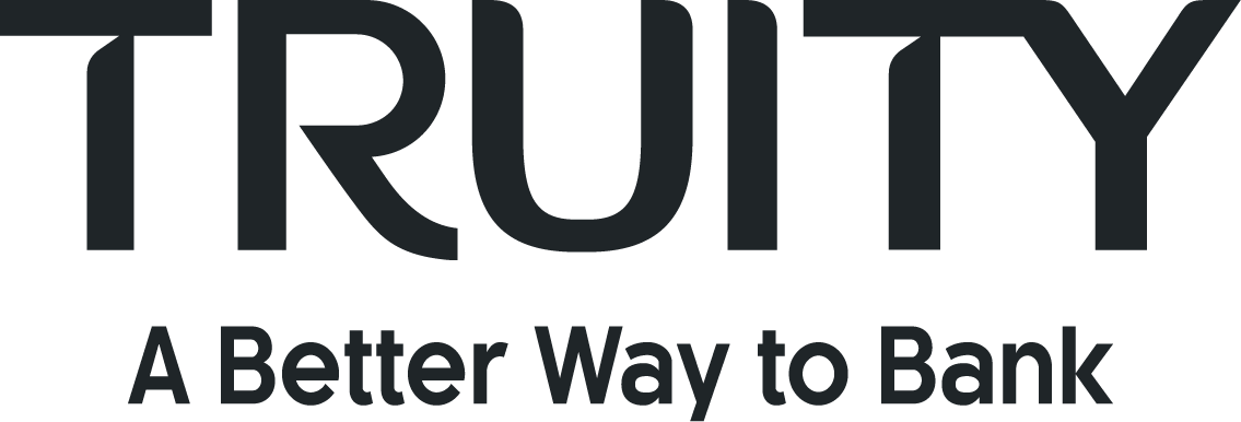 Logo for a credit union featuring a stylized, upward-curving flame in yellow and red, above the words 