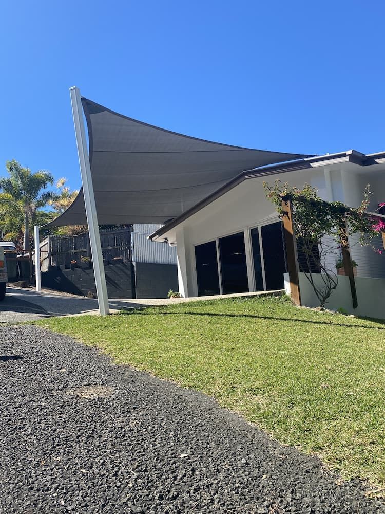 A House With A Large Shade Sail In Front Of It β SPF Shades and Sails in Tweed Heads West, NSW
