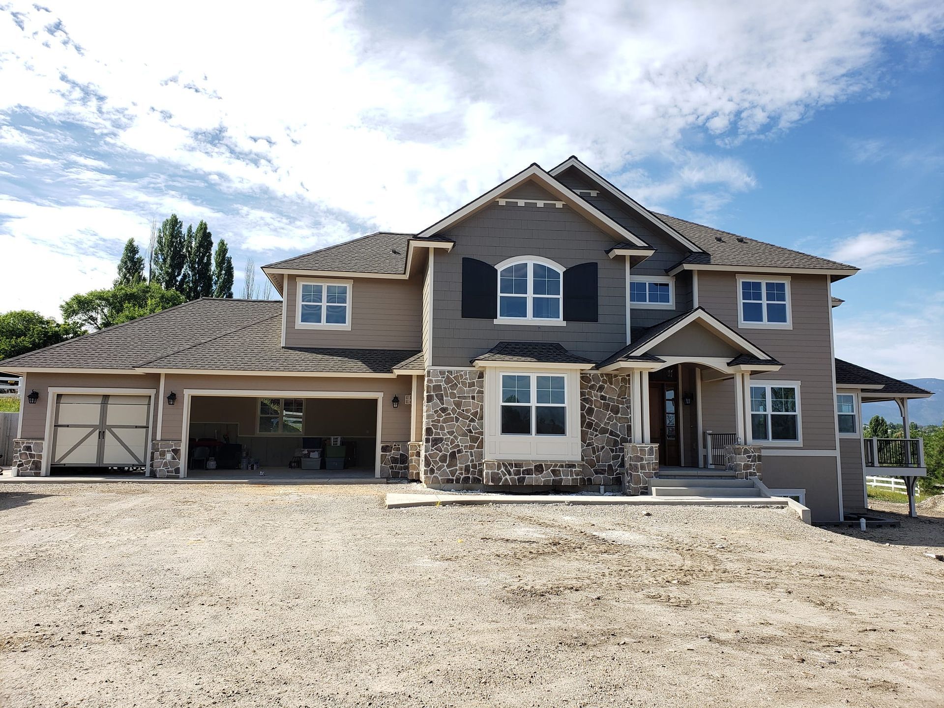A large house with a lot of windows and shutters