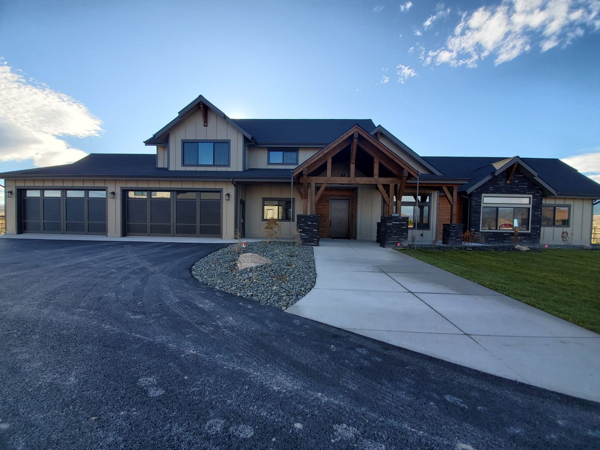A large house with a concrete walkway leading to it