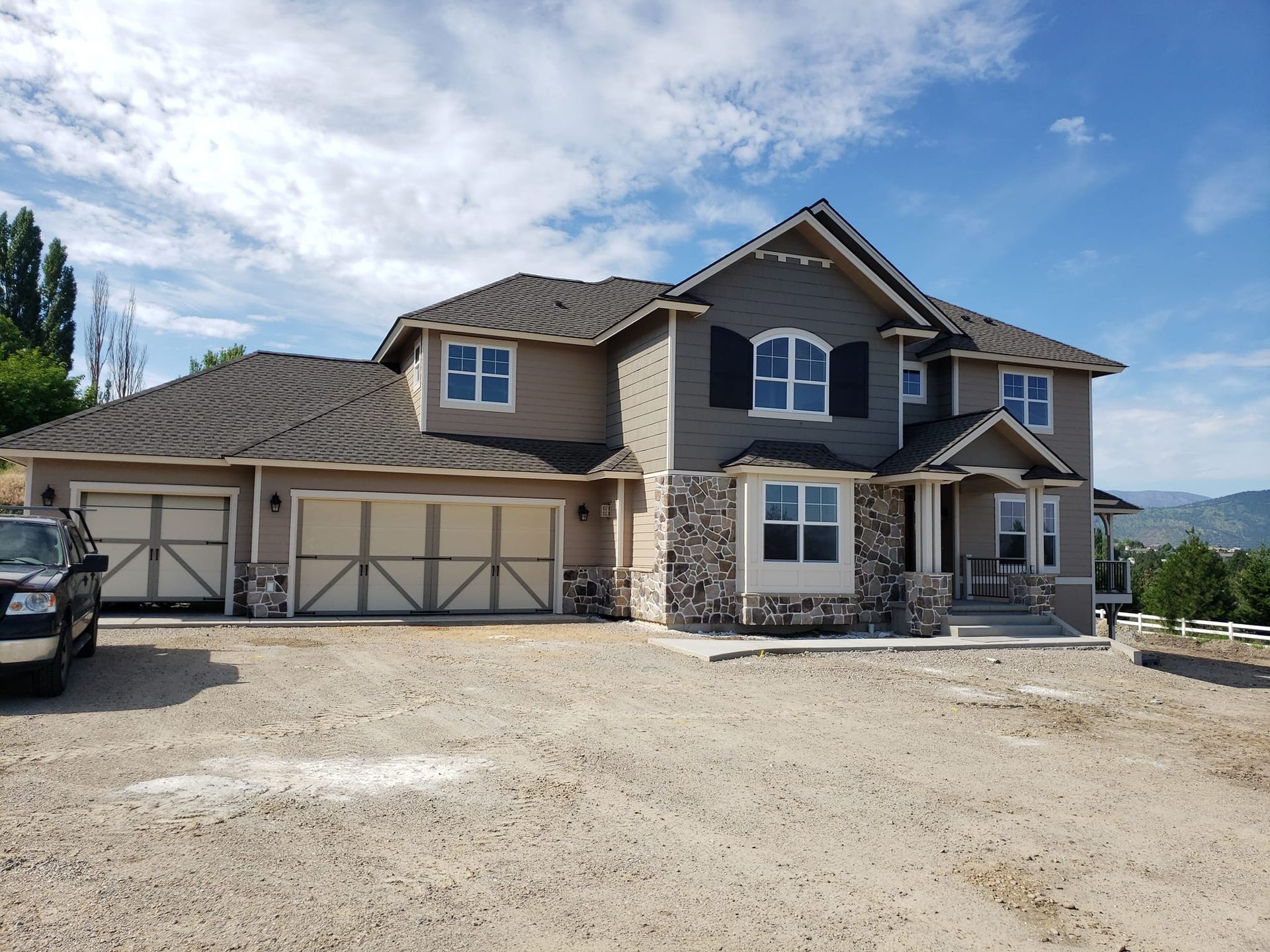 A large house with a car parked in front of it