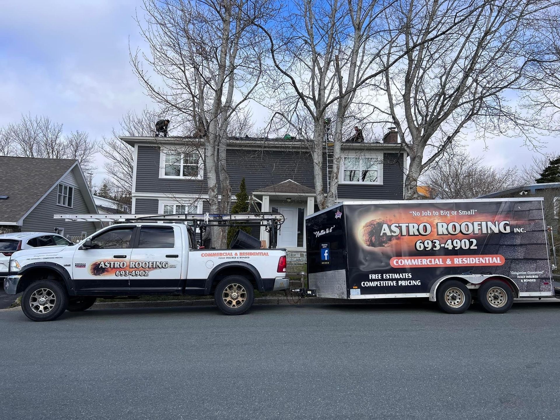 A white pickup truck towing a trailer with 
