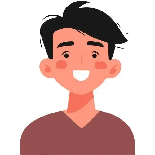 A woman in a blue scrub top is smiling for the camera.