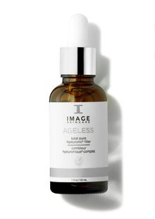 A bottle of image ageless serum with a dropper