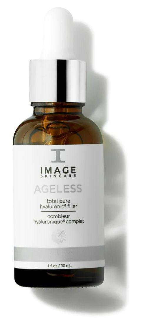 A bottle of image ageless serum is sitting on a white surface.