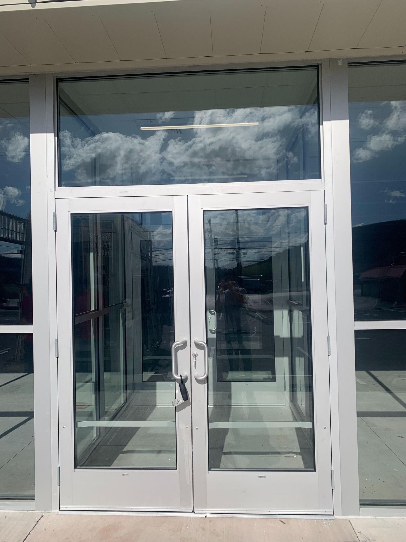 A building with a lot of glass doors and windows