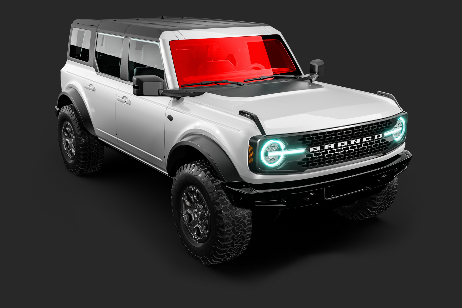 White Ford Bronco SUV, black trim, tinted windows, on a gray surface.