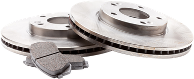 Two silver brake rotors with a pair of gray brake pads on a white background | Boeser Automotive