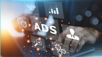 Person using a laptop, interacting with digital 