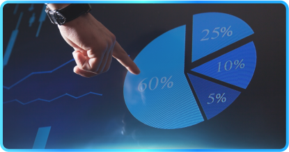 Four people collaborate around a table with laptops, papers, and a phone in an office setting.