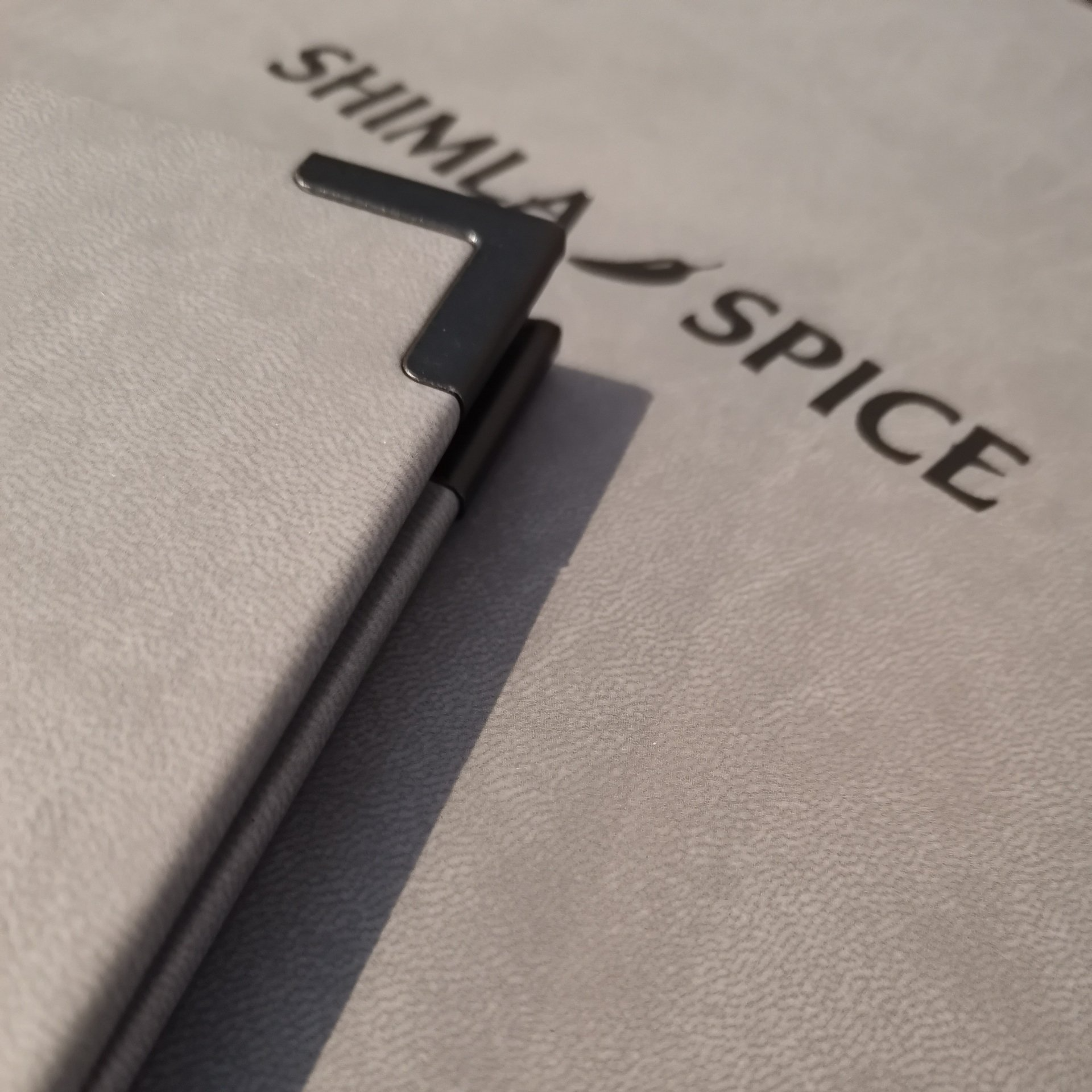 grey menu covers with black foil and edge protectors