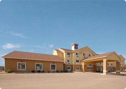 A large building with a blue sky in the background