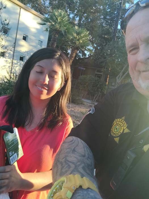 A man and a woman are posing for a picture