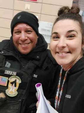 A man and a woman are posing for a picture together.