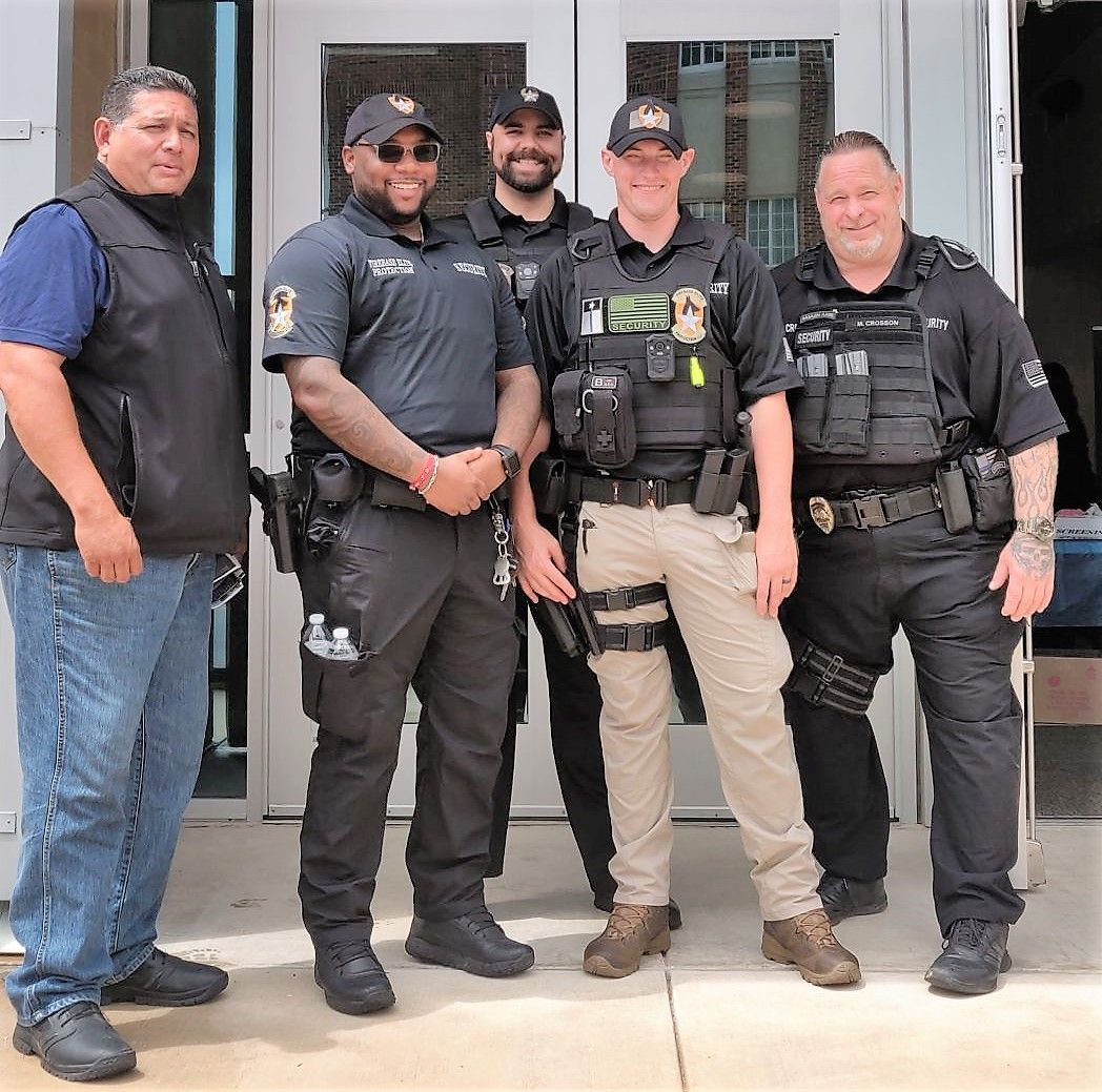 A group of police officers are posing for a picture