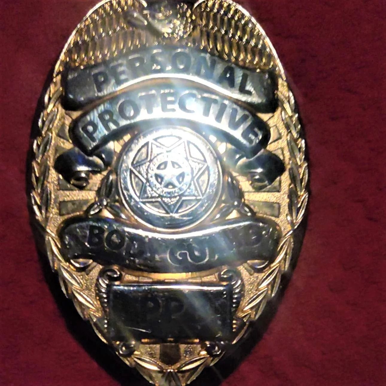 A badge that says personal protective on it