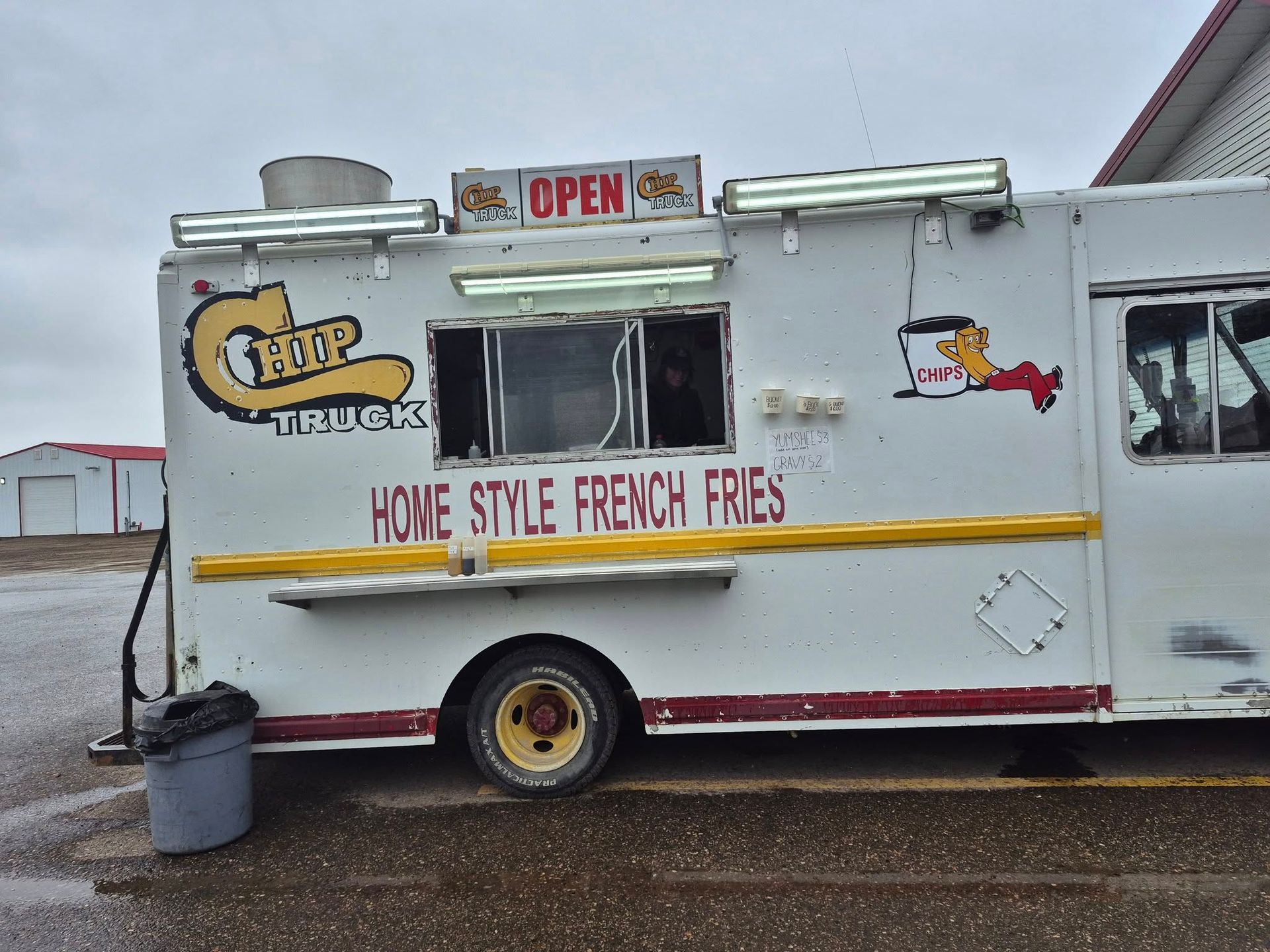 A white food truck that says home style french fries on it