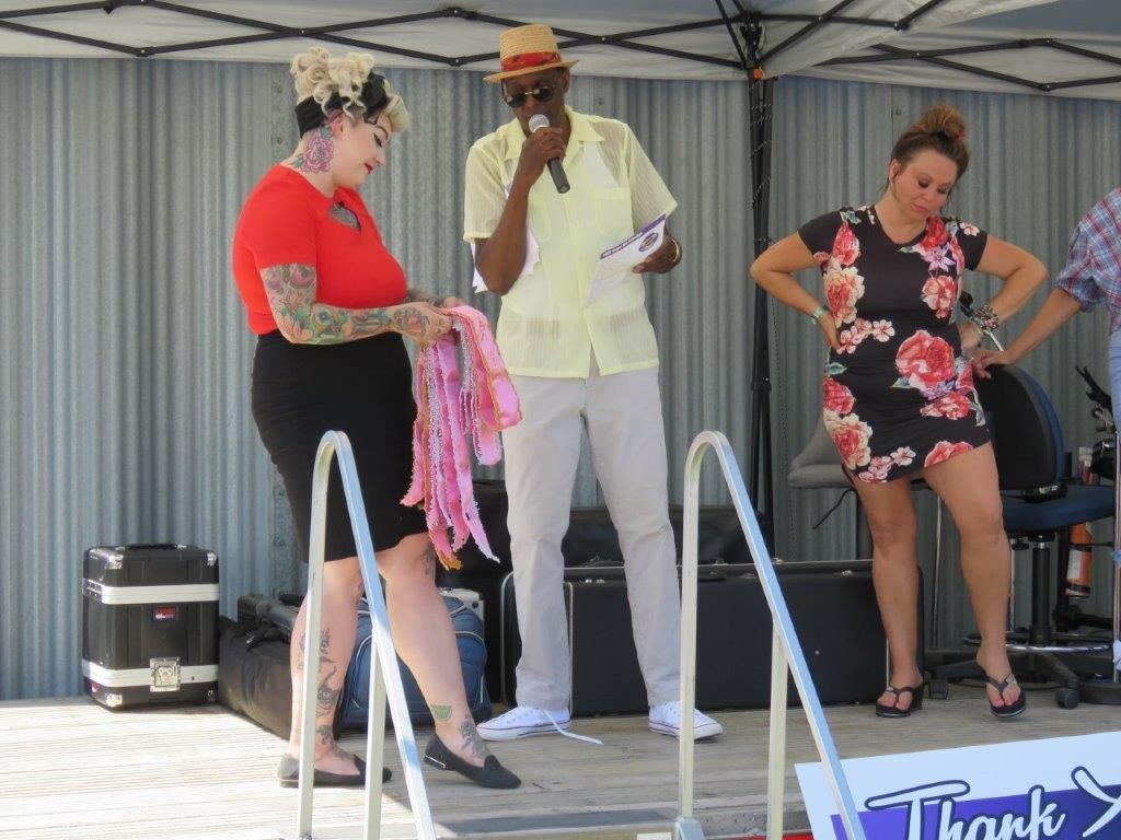 A group of people standing in front of a thank you sign
