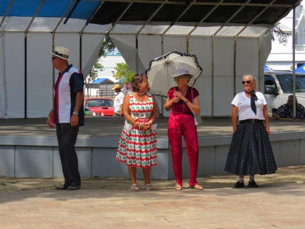 A group of people are standing in front of a stage.
