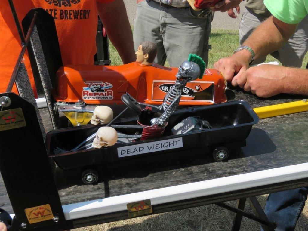 A black container with gear weight written on it