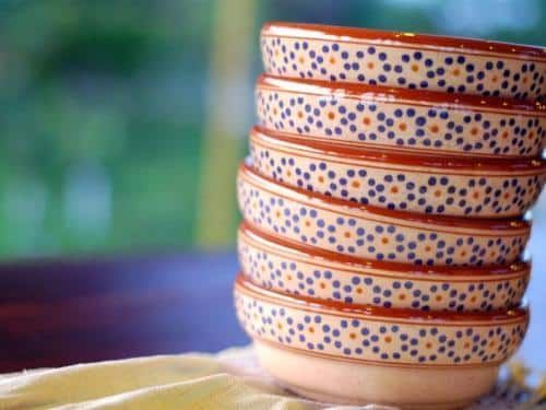 A stack of bowls sitting on top of each other on a table.