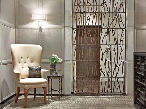 There is a chair and a table in the room.