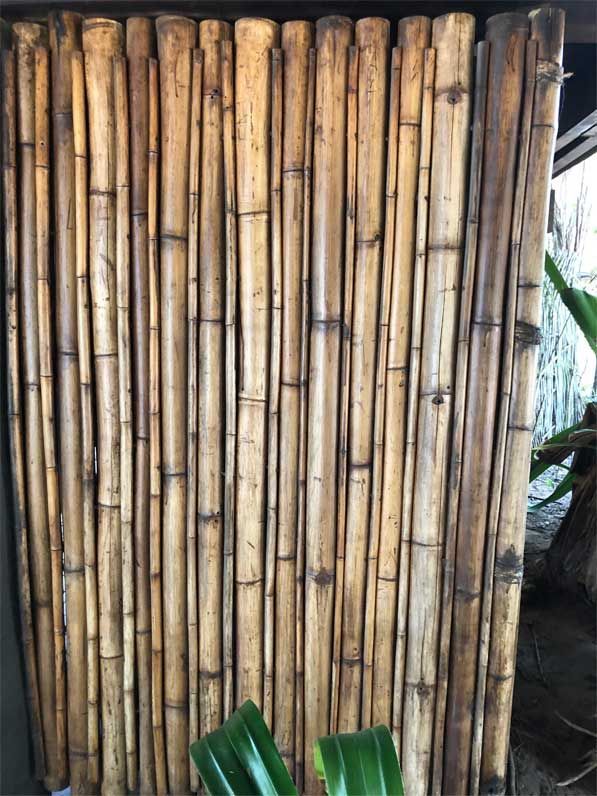 A bunch of bamboo sticks stacked on top of each other.