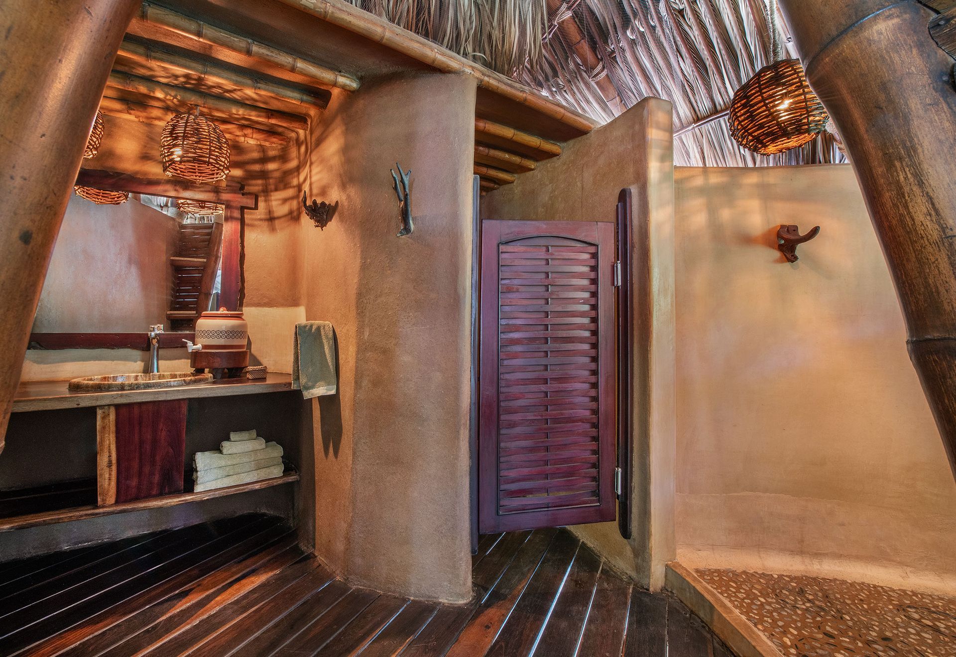 A bathroom with a wooden floor and a purple door