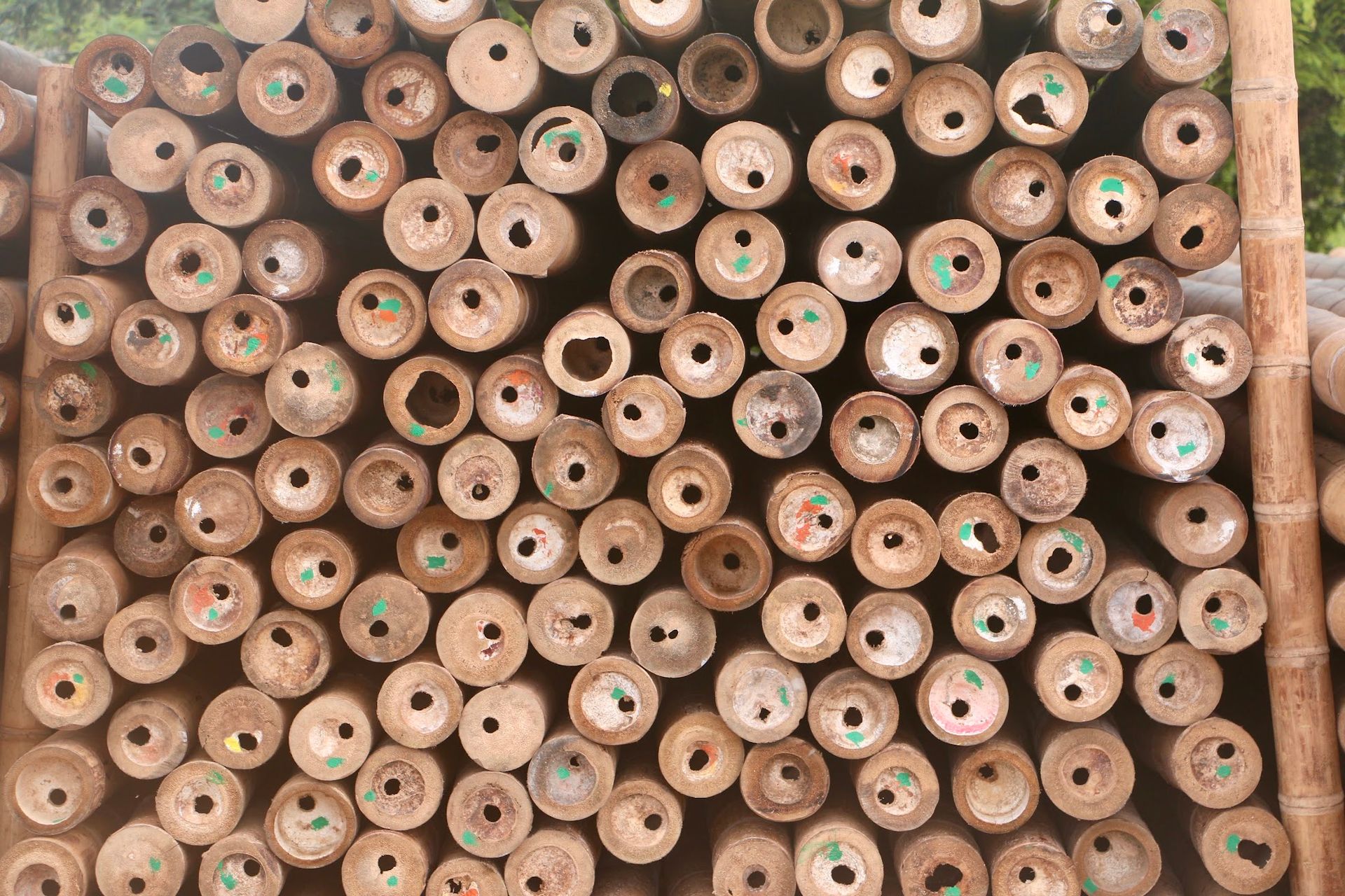 A pile of wooden logs stacked on top of each other.