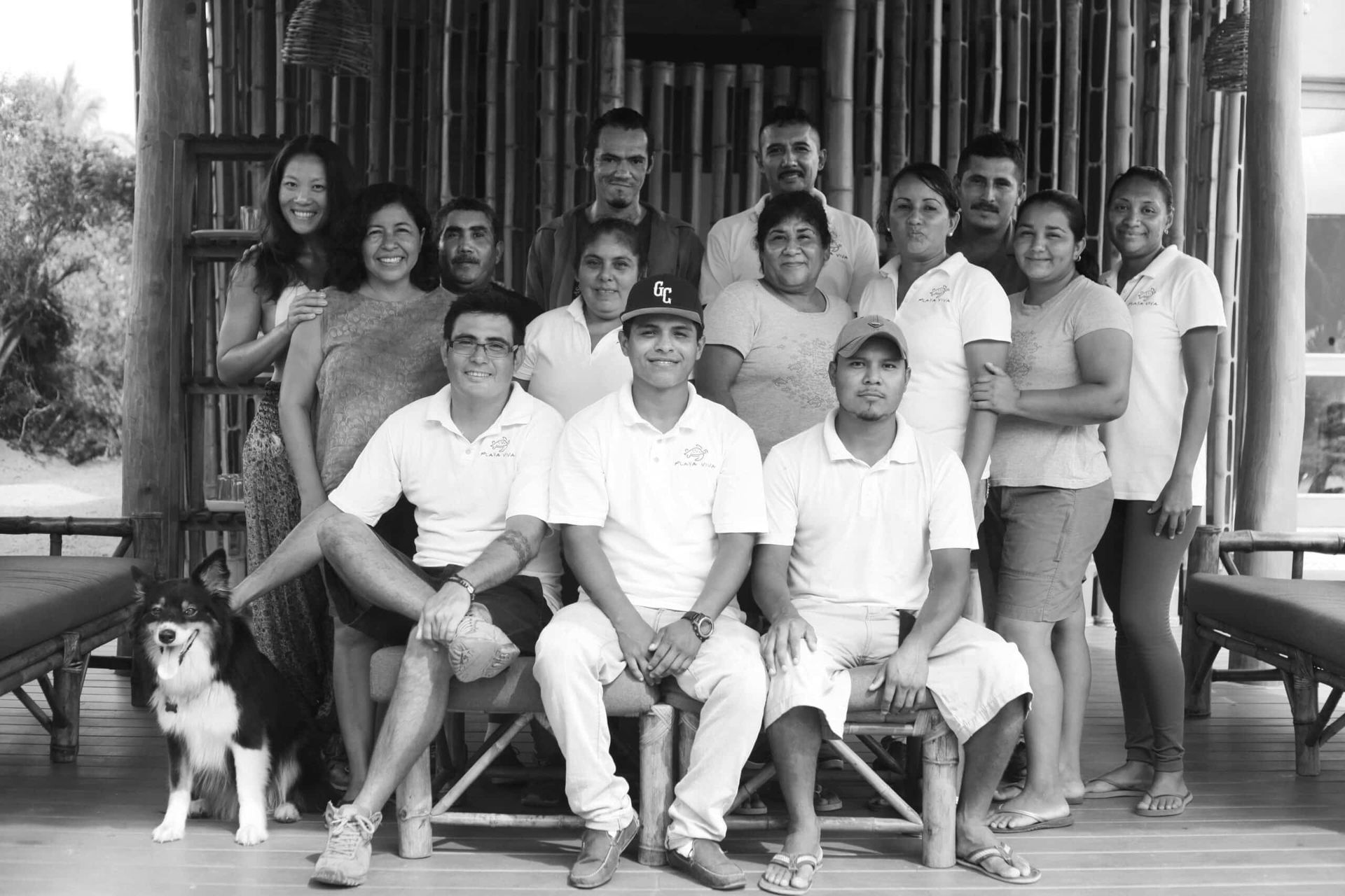 A black and white photo of a group of people posing for a picture.