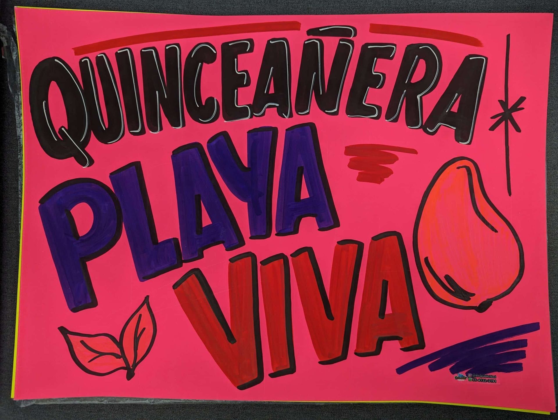A pink sign that says quinceanera playa viva