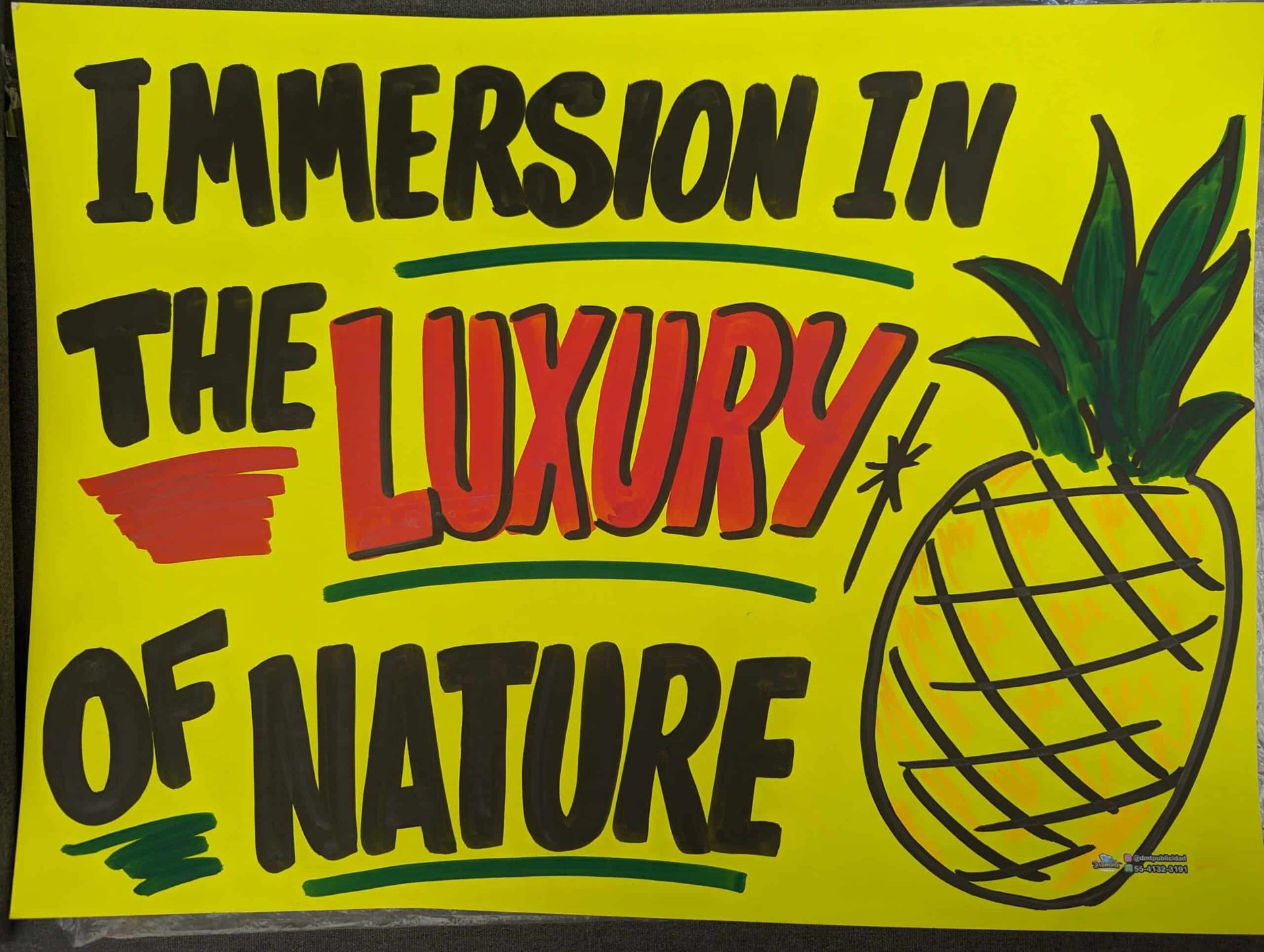 A yellow sign that says immersion in the luxury of nature