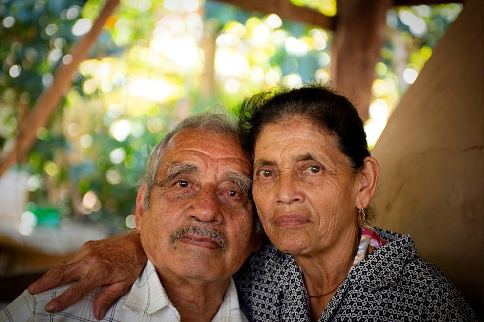 A man and a woman are posing for a picture together.