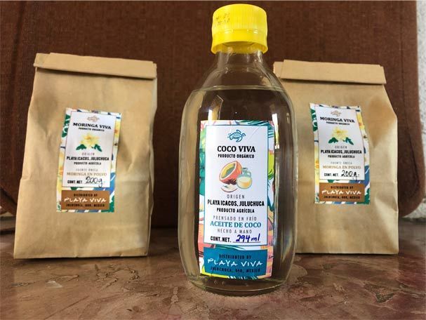 A bottle of coco viva sits next to three bags