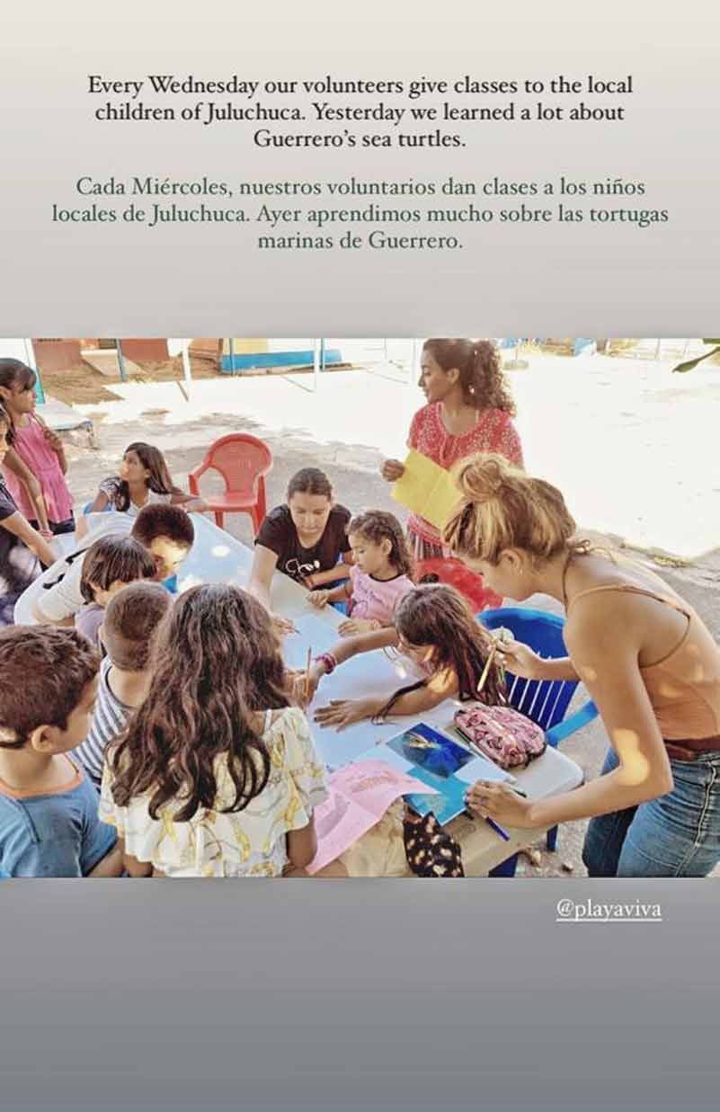A group of children are sitting around a table.