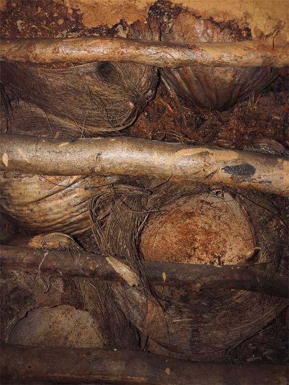 A close up of a pile of wood and rocks.