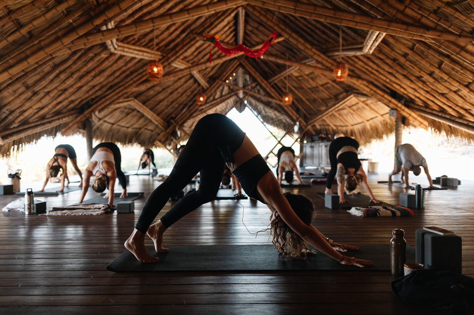 A sunset over a beach with a pink sky