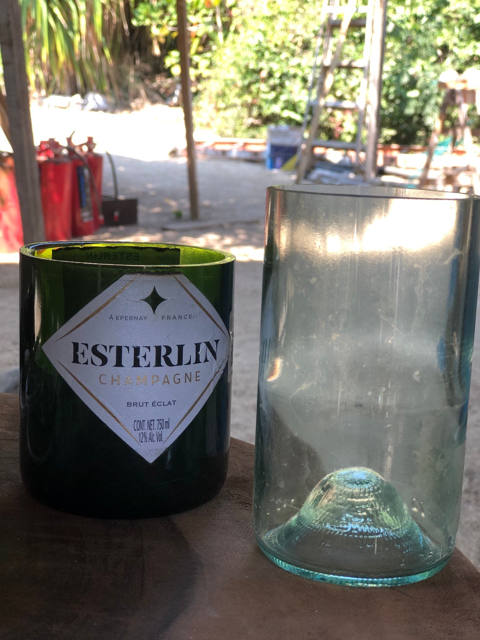 A bottle of esterlin sits next to an empty glass