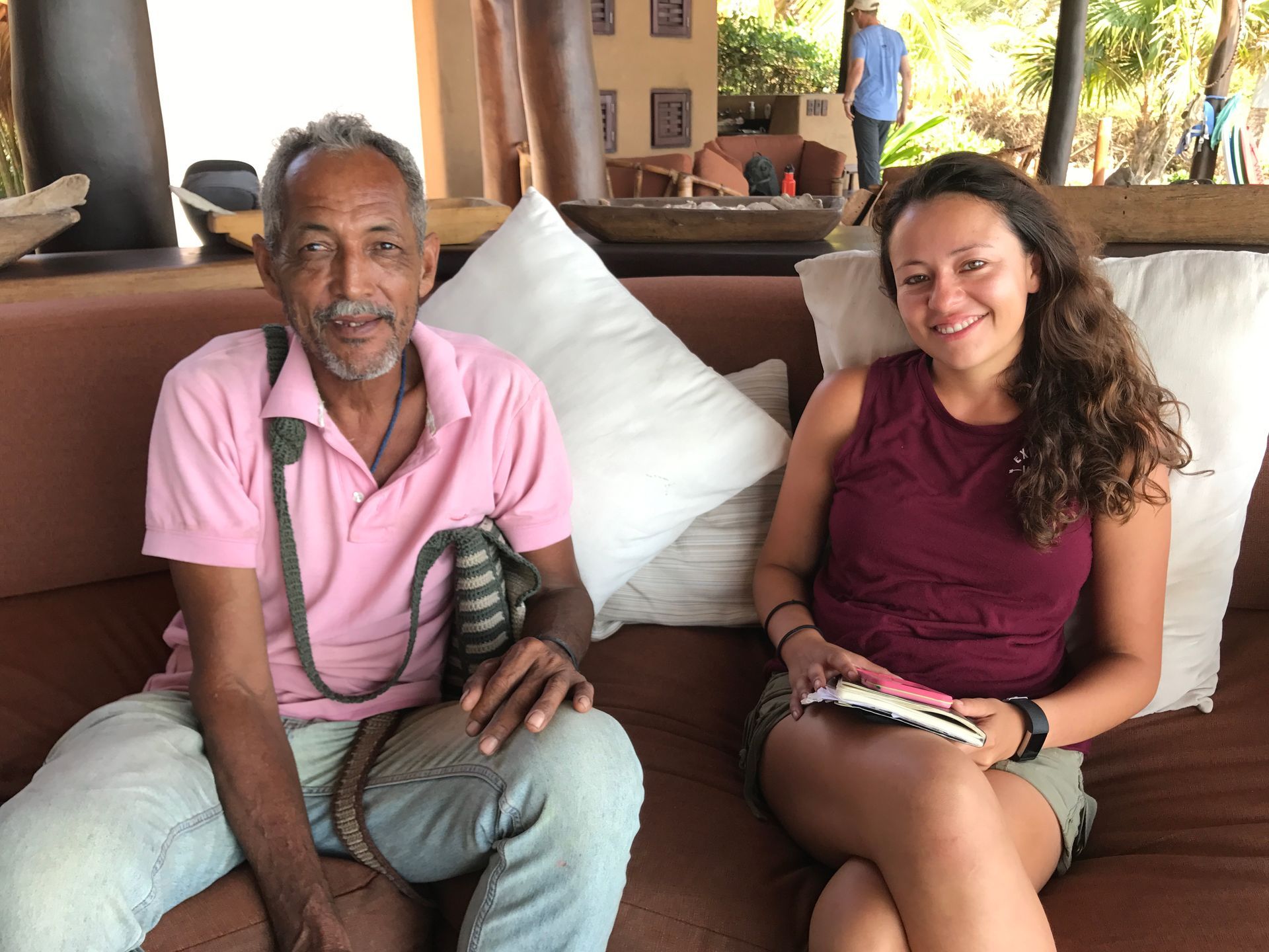 A man and a woman are sitting on a couch.