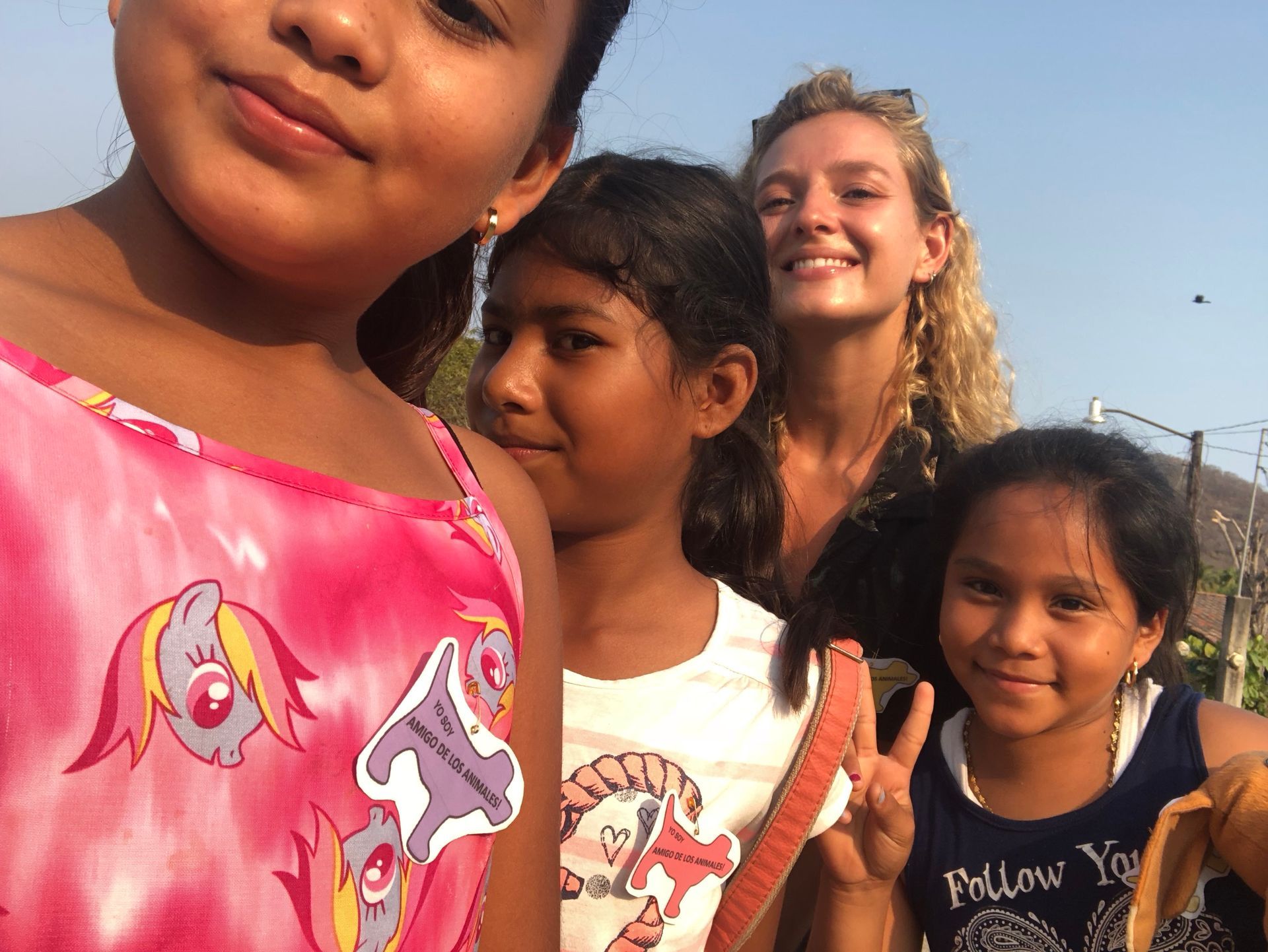 A girl wearing a shirt that says follow you