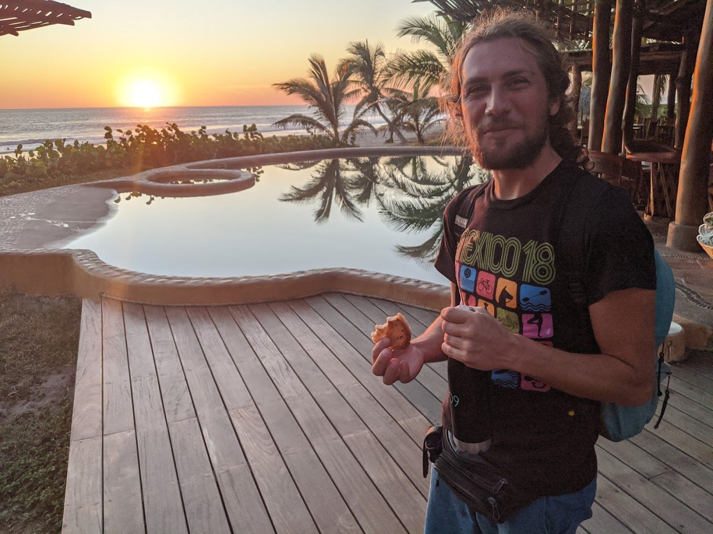 A man wearing a t-shirt that says ' snoop dogg ' on it