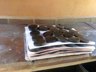 A stack of black circles on a piece of paper