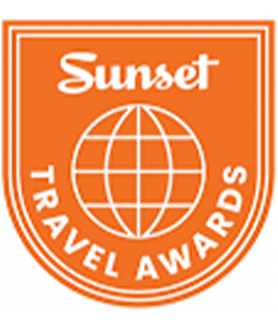 Sunset travel awards logo with a globe in the center