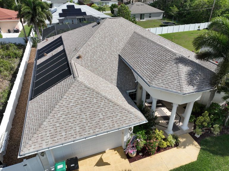 A home in Stuart, FL, with a new roof installed by a roofing contractor
