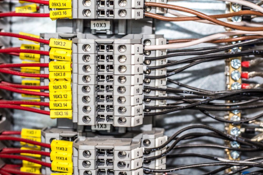 A Close Up Of A Electrical Panel With Lots Of Wires And Connectors — Wylec In Mayfield West, NSW