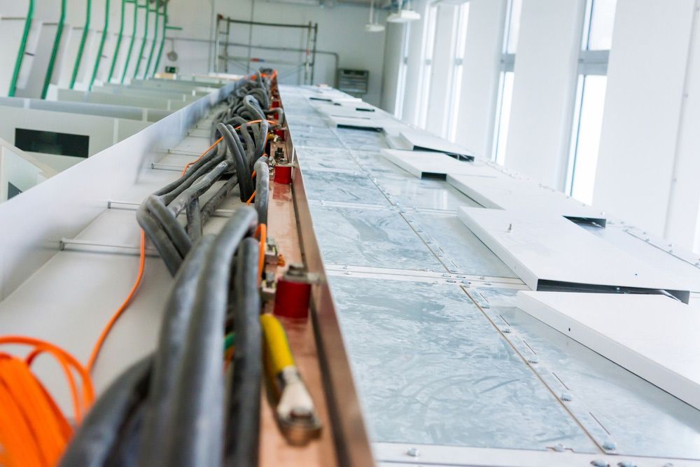 A Bunch Of Wires Are Laying On The Floor Of A Building — Wylec In Lake Macquarie, NSW