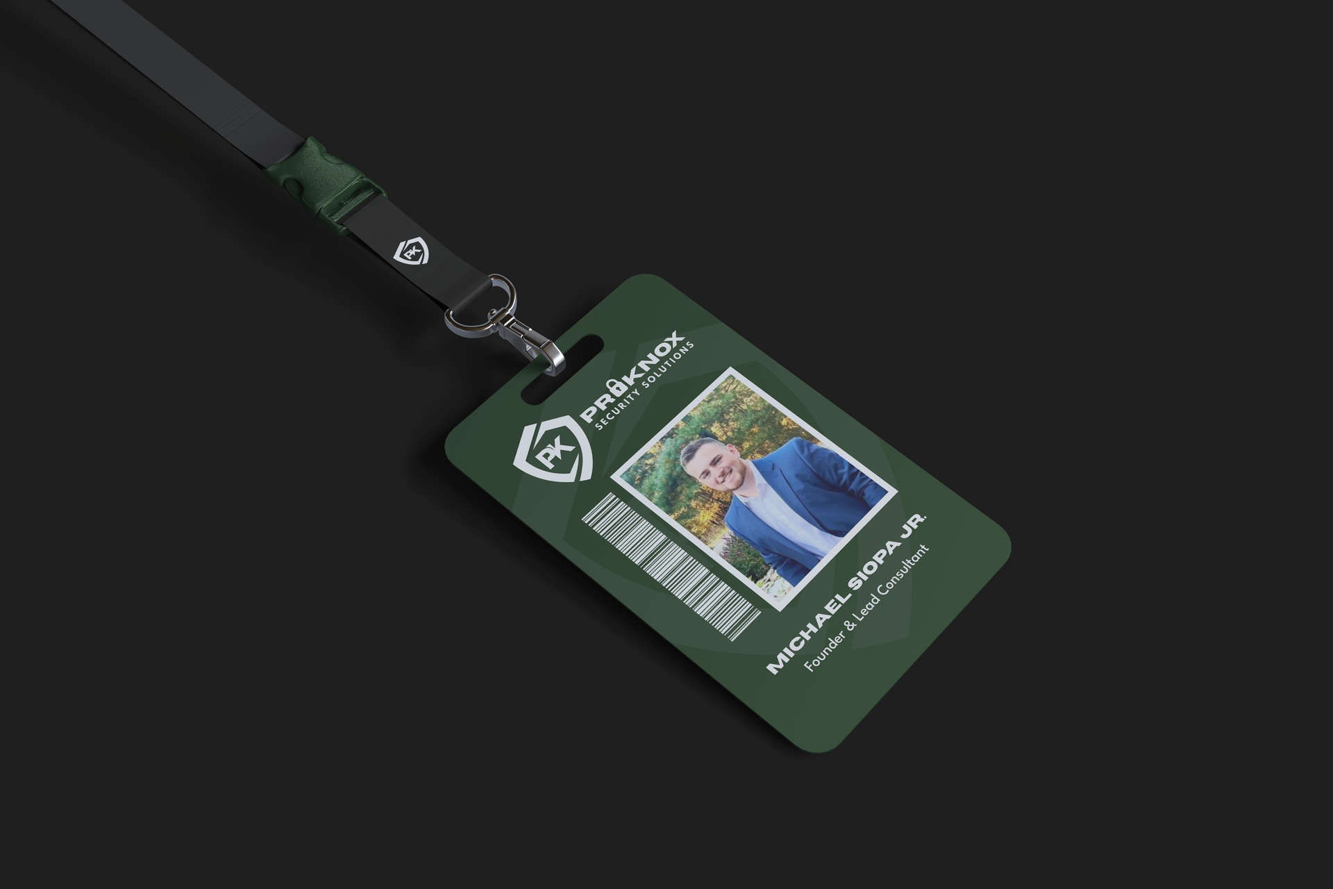 Green employee ID with photo, name, and barcode on a lanyard against a black background.