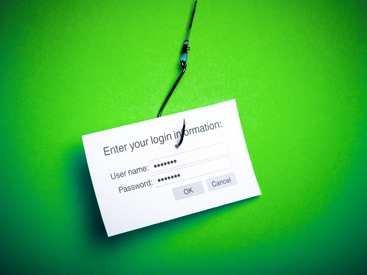 Phishing scam: Login form on a hook against a green background.