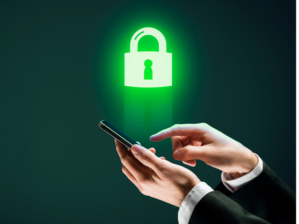 A person is holding a cell phone with a padlock coming out of it.